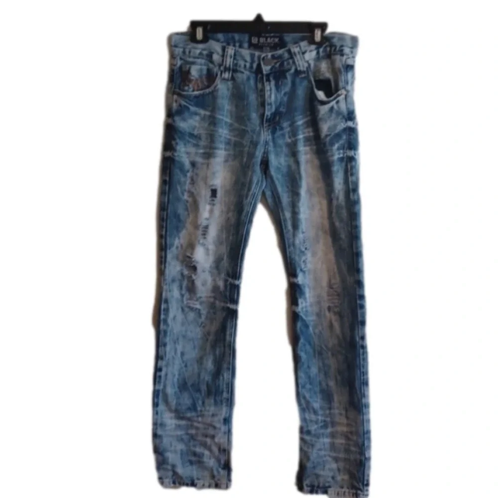 Black brand super distressed, acid wash looking jeans.Size 30x32.